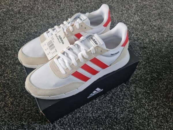 Red and white adidas trainers