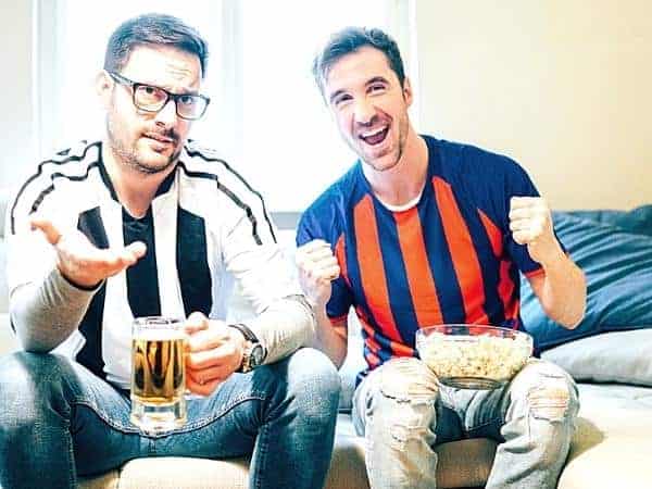 football supporters with beer and popcorn.