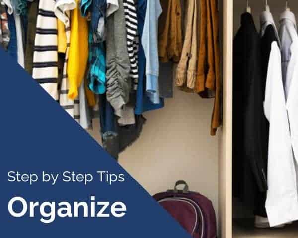 child's closet with hanging clothes in assorted colors and patterns