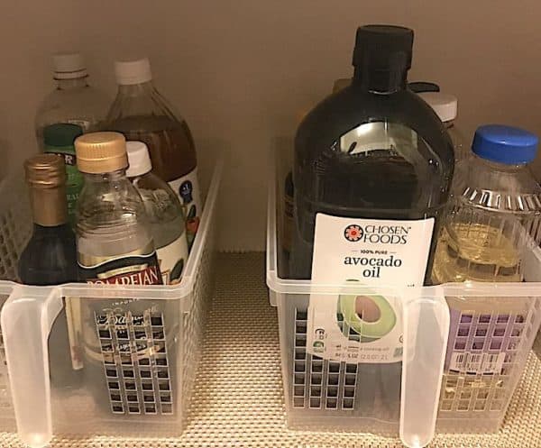 Pantry Organization: Vinegars and Oils in Clear Handled Bins