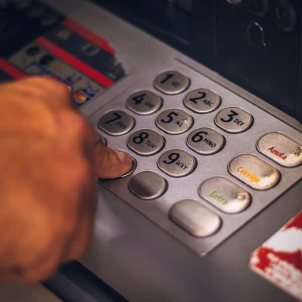 child learning to use an ATM