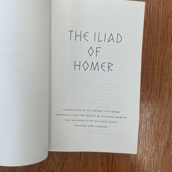 A breathtaking image of the opening page of "The Iliad of Homer," showcasing a classic literary translation, printed by University of Chicago Press, highlighting ancient Greek epic poetry and scholarly editions.