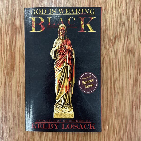God is Wearing Black by Kelby Losack