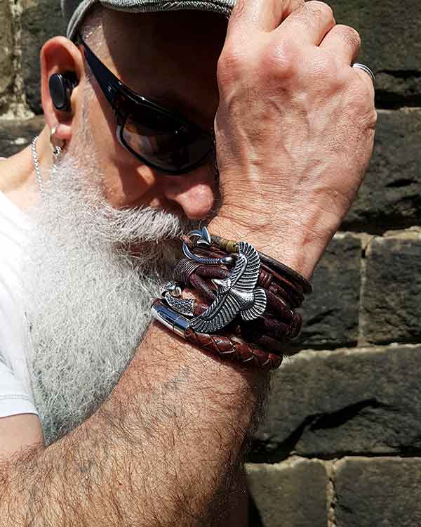 Image of a man wearing handmade bracelets by Antikuos