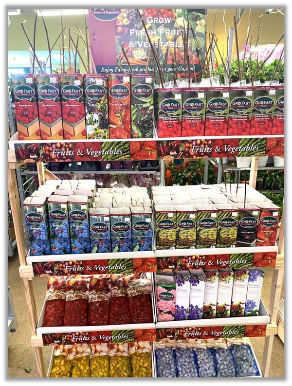 Assorted flavored drink mixes and powders displayed on shelves.
