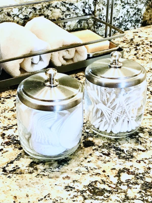 https://sp-ao.shortpixel.ai/client/to_webp,q_lossy,ret_img,w_600,h_800/https://organizenvy.com/wp-content/uploads/2020/04/Bathroom-Vanity-Apothecary-Jars.jpg