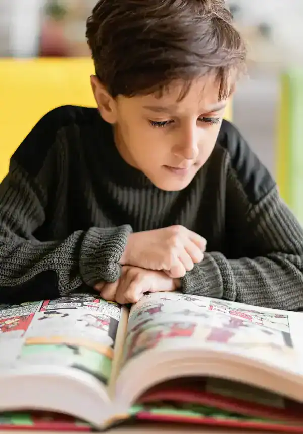 Child engaged in reading to improve reading skills.