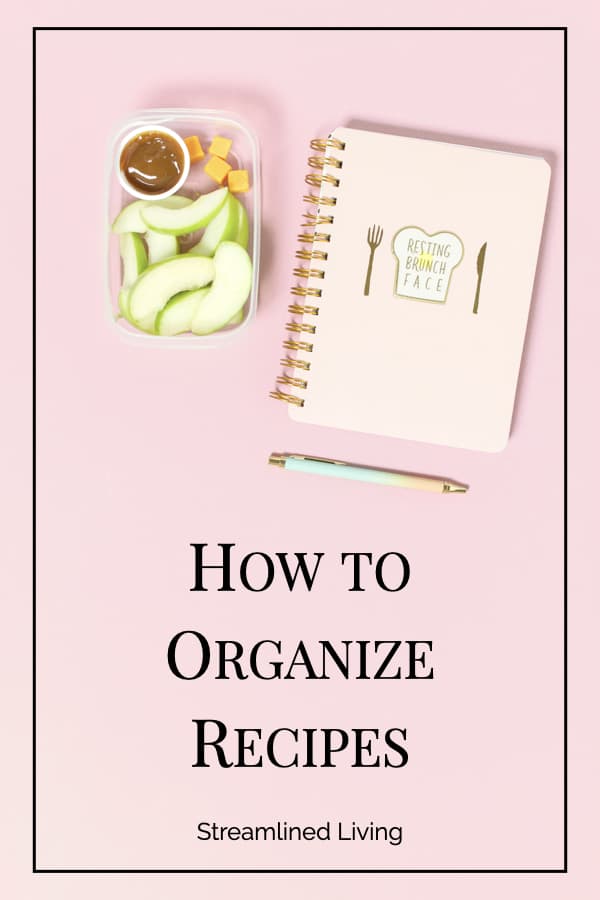 apple and dip with recipe book on pink background