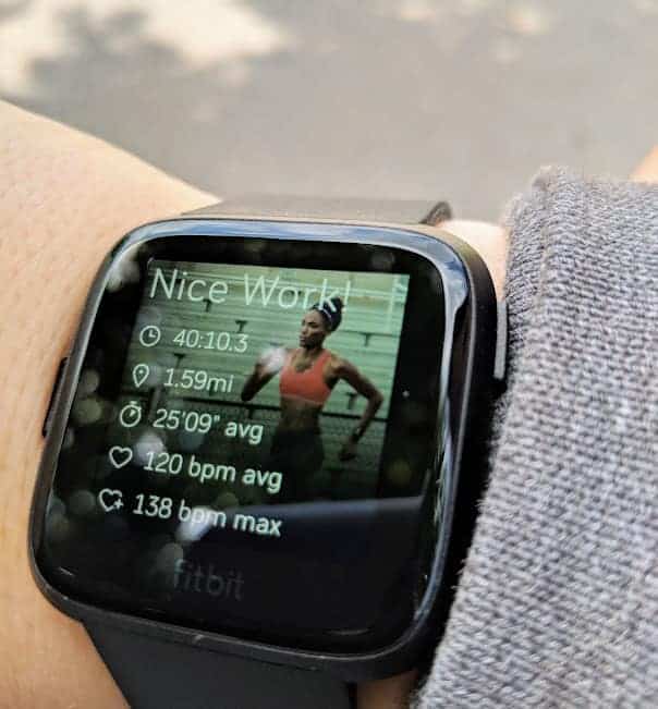 a fitbit versa on a wrist