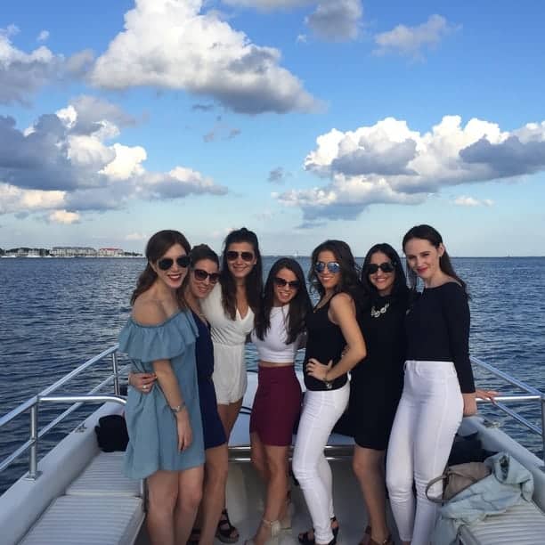Group of women dressed up on the boat. Charleston bachelorette party boat