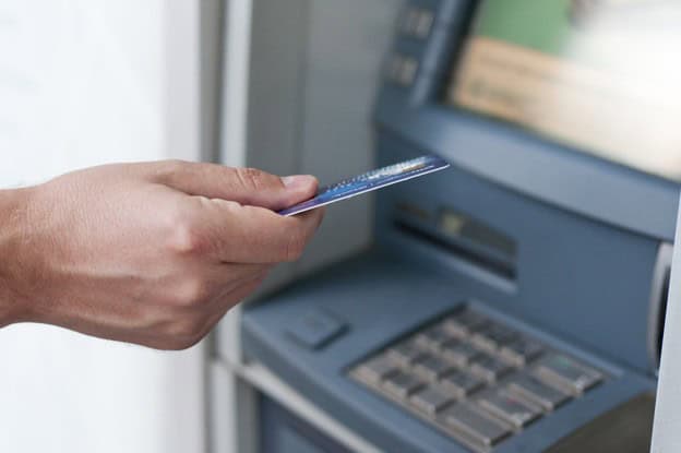 Hand inserting ATM card