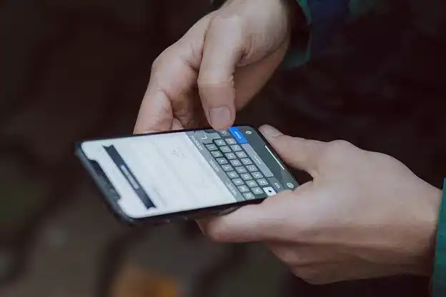 selective focus photography of person using smartphone selective focus photography of person using smartphone