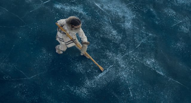 francois testing the strength of the ice in the movie "The Call of the Wild"