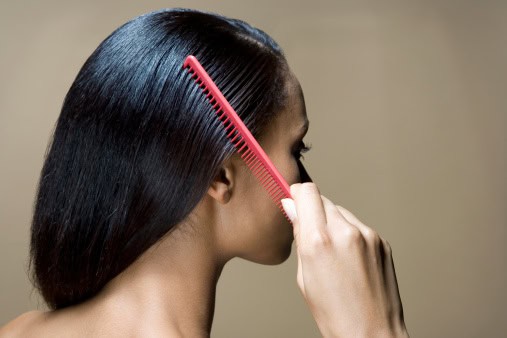 A woman combing her hair