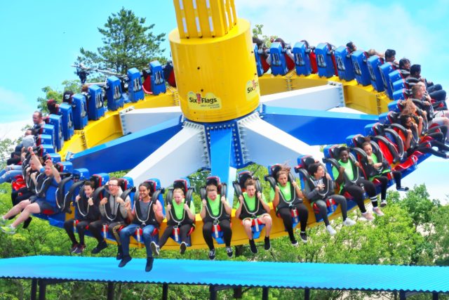 Riders sit facing outwards with their legs dangling on the new WONDER WOMAN Lasso of Truth ride