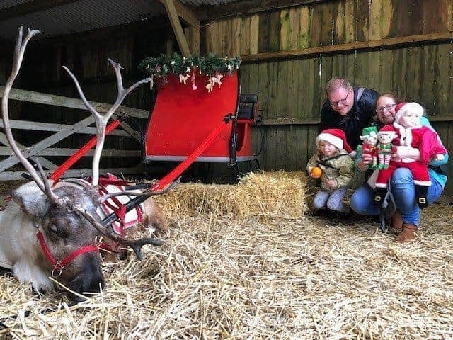 looking back over 2018 - the four of us by santas sleigh with reindeer