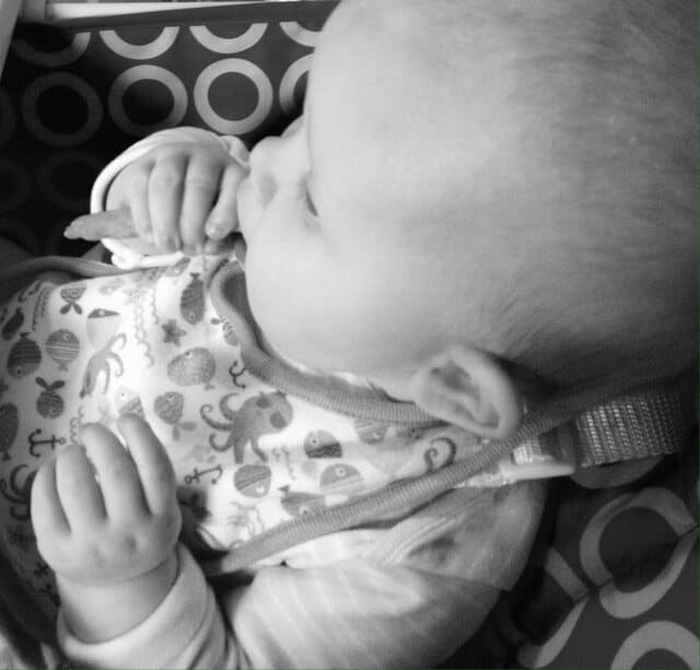 Baby girl enjoying her pumpkin and banana wafer wisp - Rachel Bustin