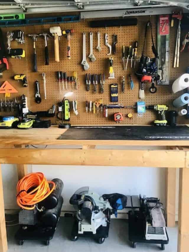 a workbench with tools on a pegboard