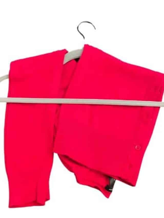 Red sweater folded over a hanger
