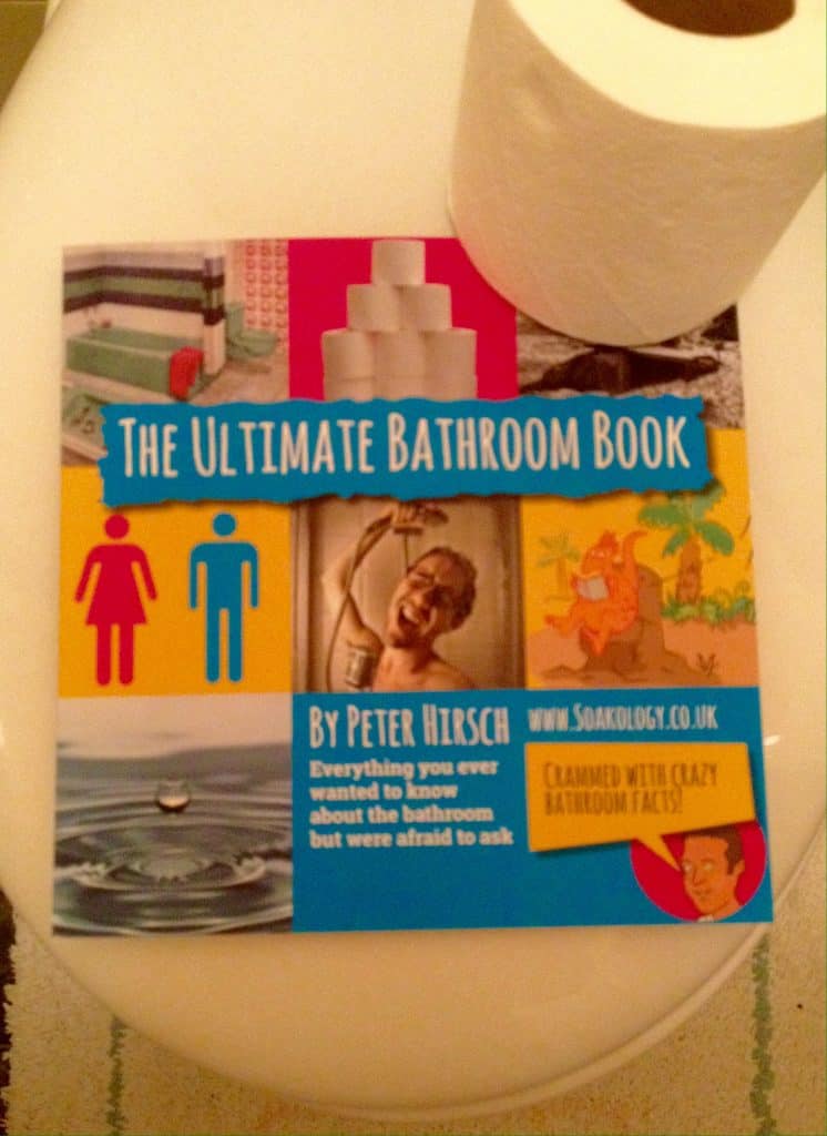 The ultimate bathroom book on a toilet with loo roll