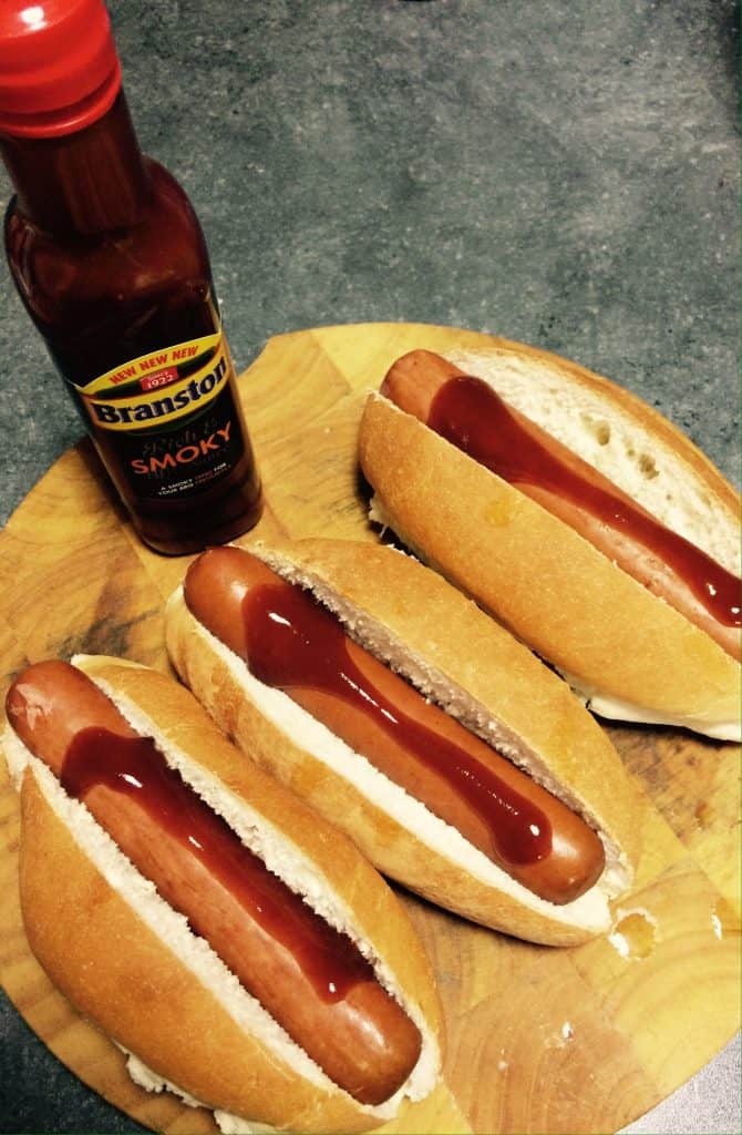 Branston smoky BBQ sauce on hots dogs