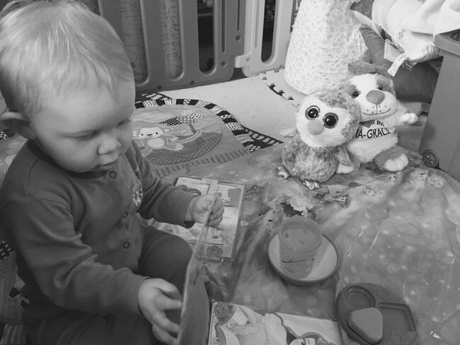 Baby girl enjoying her Beauty and the Beast tea party