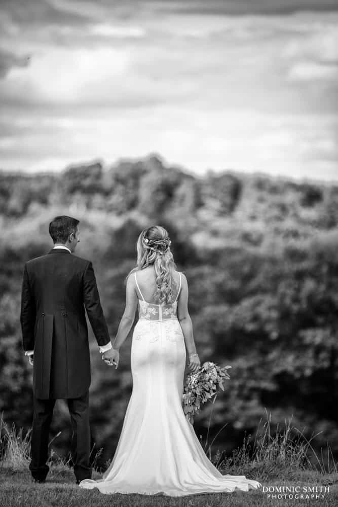 Couple photo looking out towards the hills at Nymans