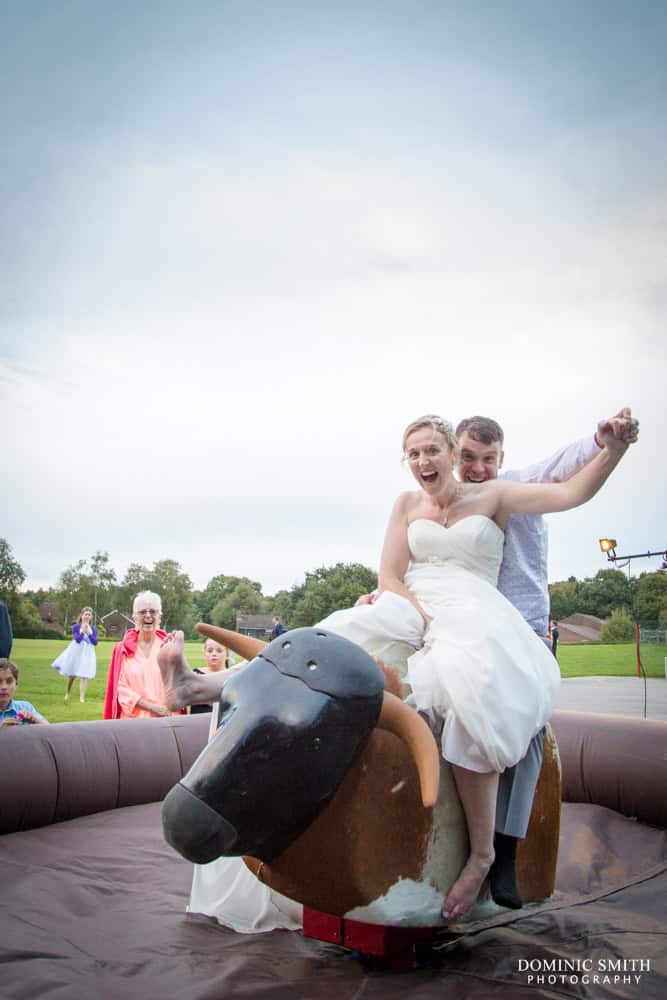 Bride and Groom ride the Bucking Bronco