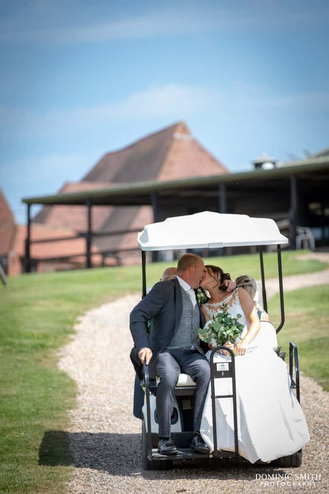 Bride and Groom riding the golf cart at Blackstock Country Estate