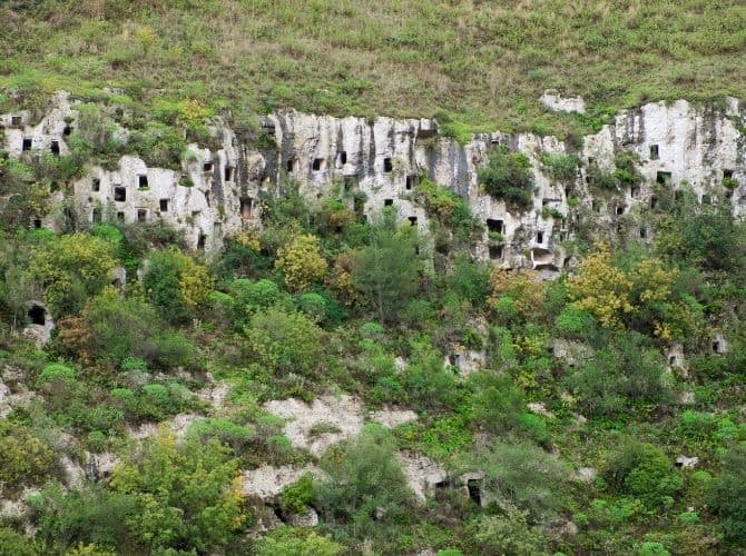 Necropoli di Pantalica Necropoli di Pantalica, bronze age tombs carved in limestone valley in Pantalica Nature Reserve