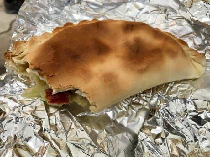 Sicilian Scaccia. Sicilian scaccia. A folded flatbread stuffed with various fillings. Looks like a cornish pasty.