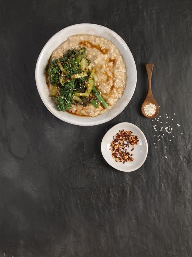 teriyaki porridge in a bowl with crushed chillis in small bowl to the side