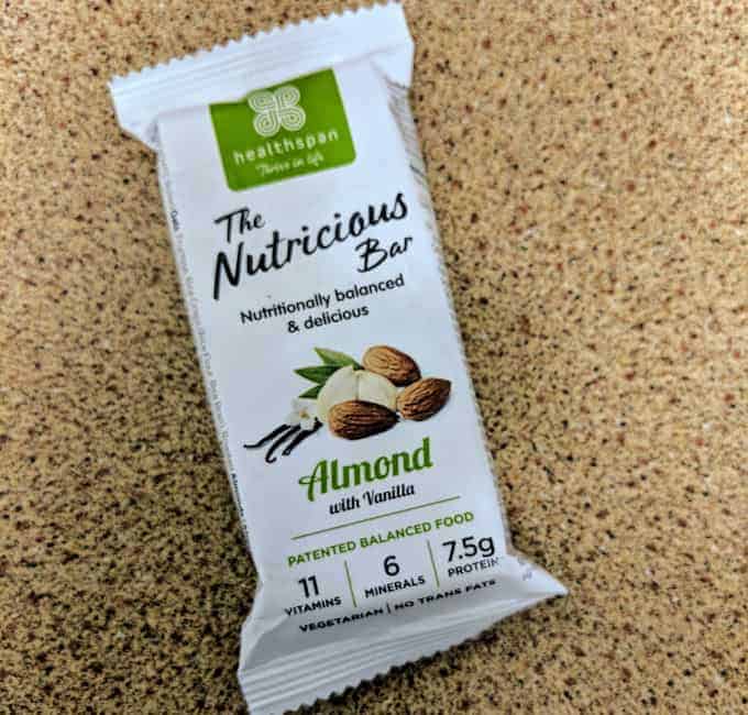 The Nutricious snack bar on brown surface