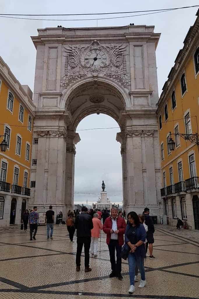 The grand Rua Augusta Arch (Arco da Rua Augusta) in Lisbon, leading to Praça do Comércio. One of the best Lisbon travel tips is to visit this historic site for stunning views of the city from the top.