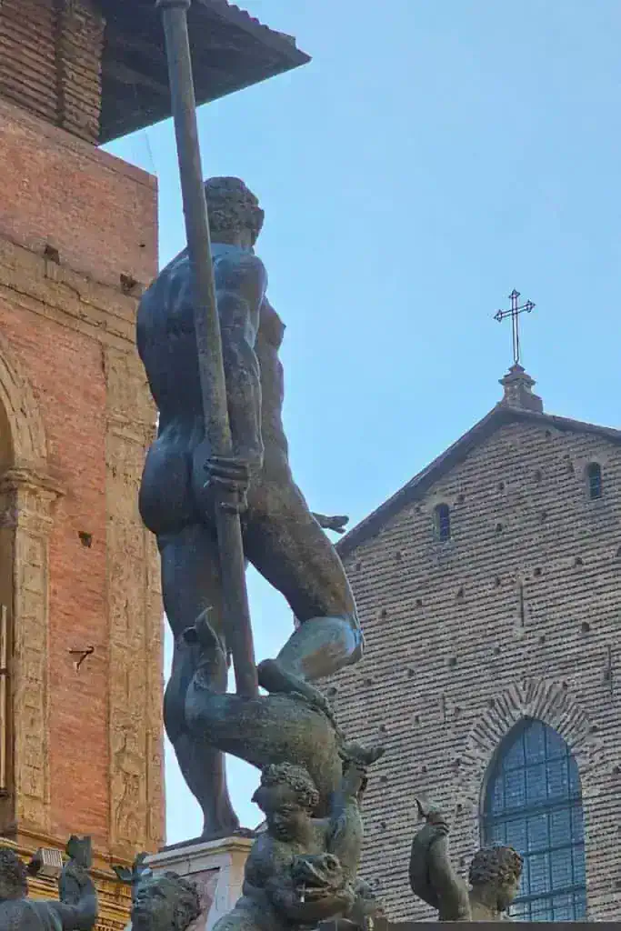 Rear view of Bologna’s Neptune statue where the famous “finger trick” creates a risqué optical illusion — a fun secret hidden in plain sight.