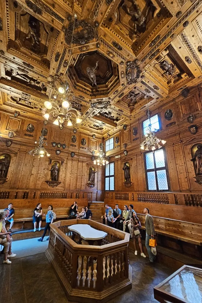 Ornately carved wooden interior of the Anatomical Theater in Bologna’s Archiginnasio, where medical students once trained—one of the city’s most unique historical photography locations.