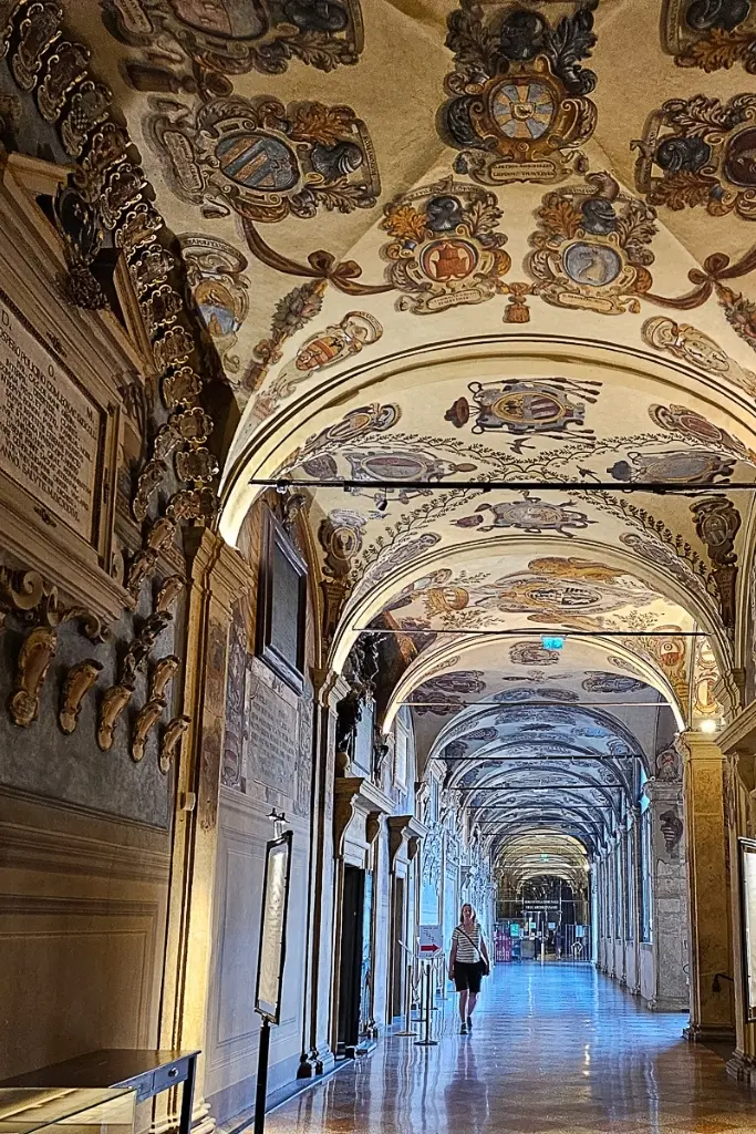Ornate hallway of Bologna’s Archiginnasio Palace—one of the top historical attractions to visit if you’re wondering is Bologna worth the trip.