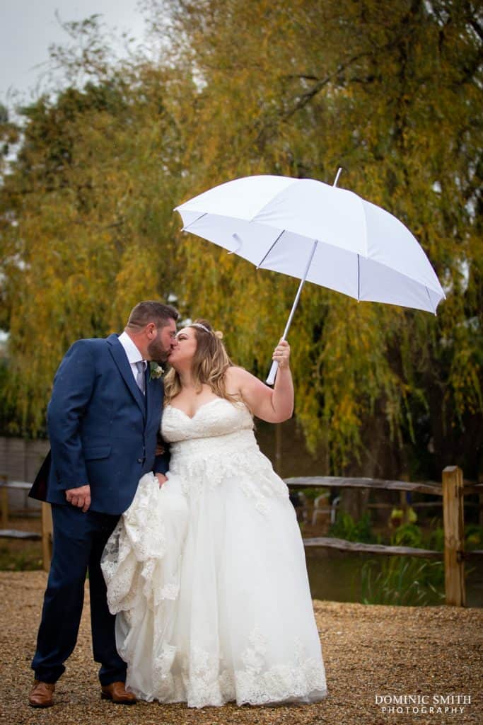 Couple photo under umbrellas at Random Hall