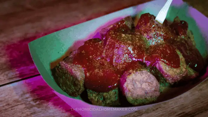Grilled sausage with a spicy, curry ketchup inspired by the horror movie Baghead