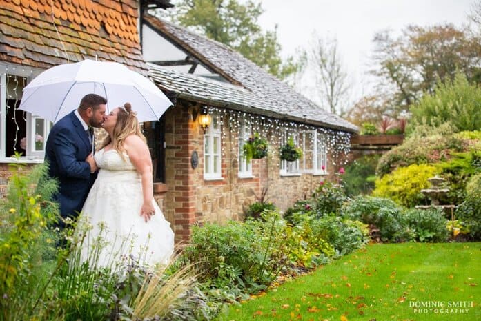 Couple photo under umbrellas at Random Hall 2