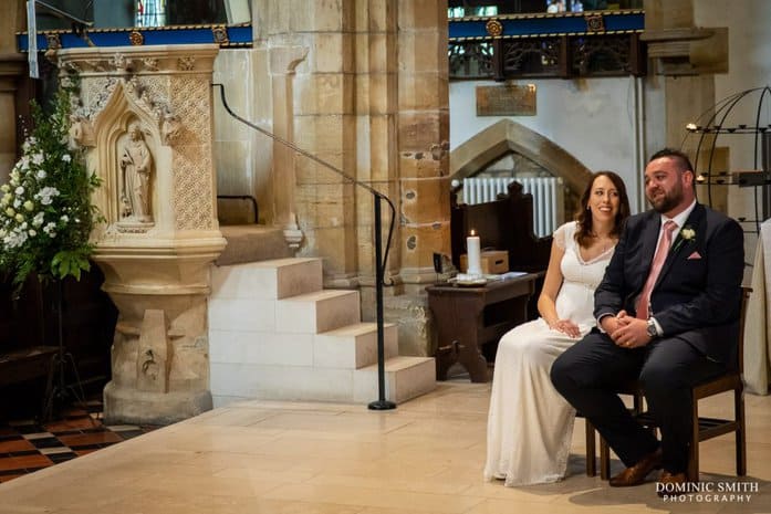 Bride and Groom during the ceremony at St Marys Church in Horsham