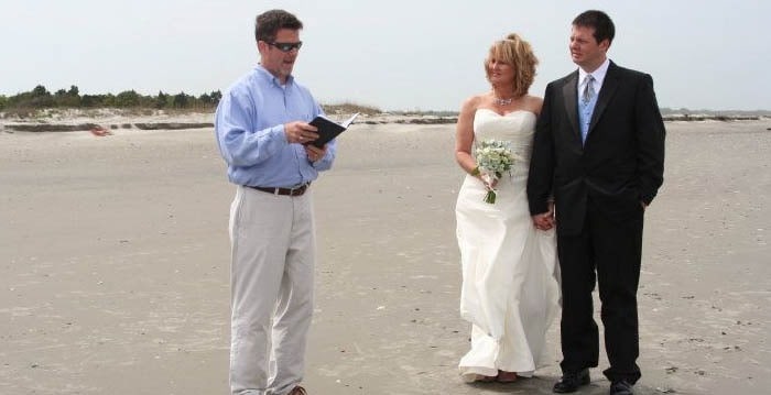 Opening ceremony with the bride and groom and officiant. Wedding dinner cruise Charleston SC