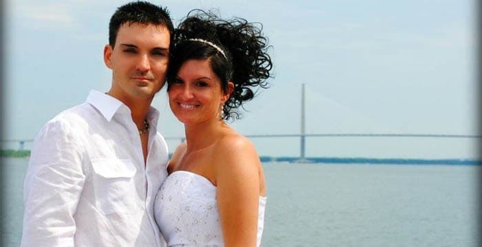 Bride and groom portrait with bridge in the background. Wedding dinner cruise Charleston SC
