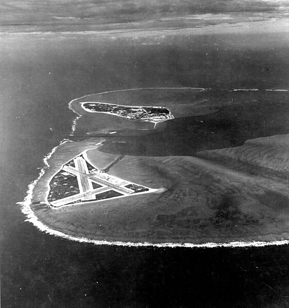 Aerial view of Midway Atoll, November 24, 1941, showing Eastern Island's airfield in the foreground and Sand Island in the background.