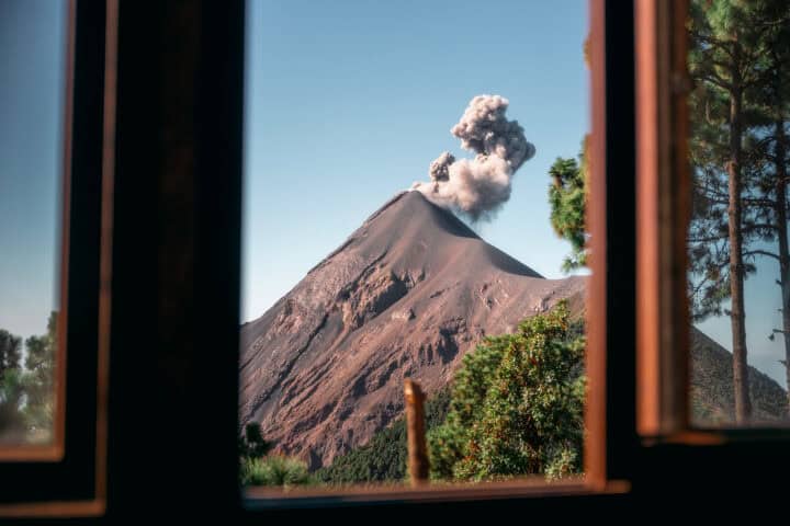 Active Fuego volcano erupting as seen through the window of an OX Expeditions cabin at Acatenango