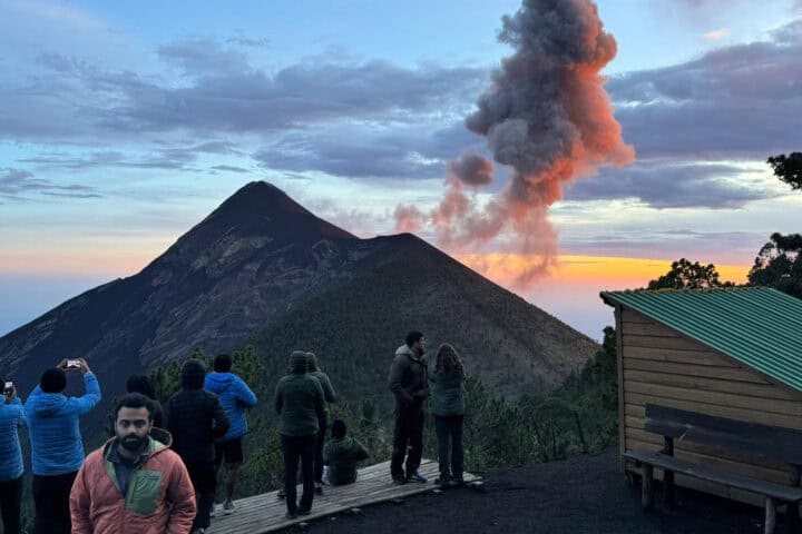 Smoke plume rising from Fuego volcano at sunset as seen from Acatenango campsite