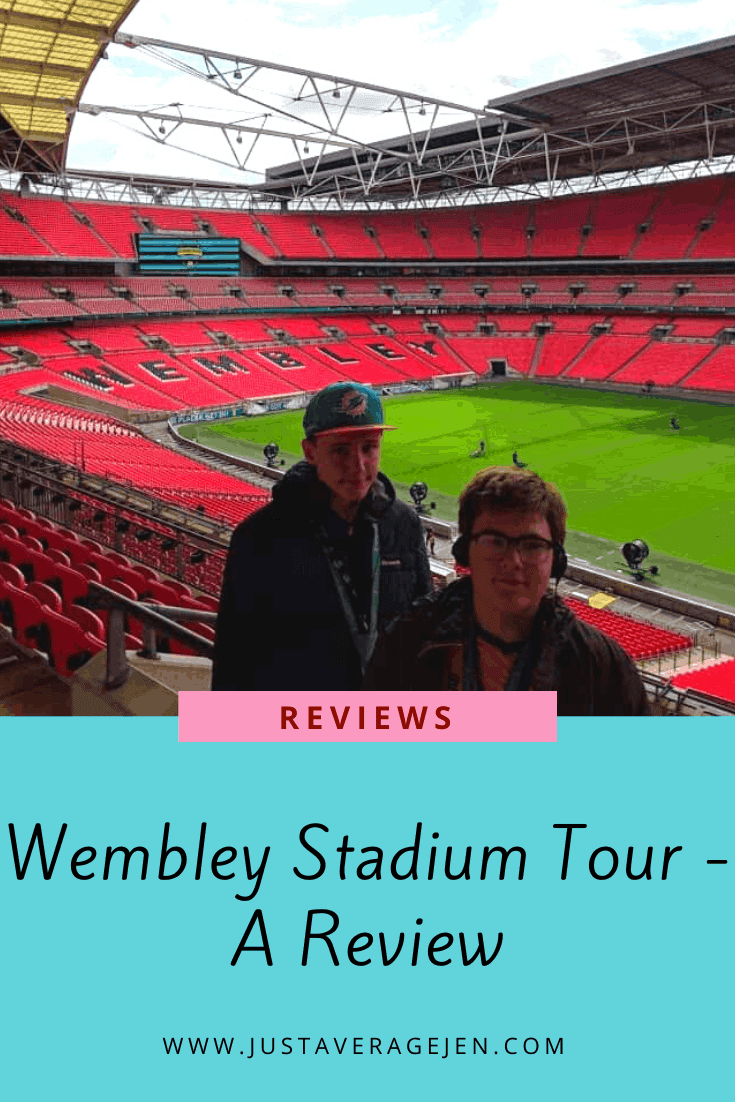 Two people standing in the stands of Wembley Stadium