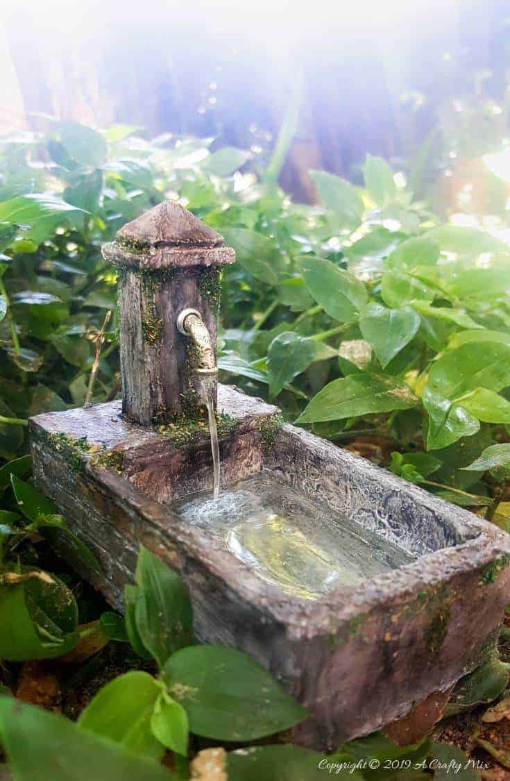 How to make a beautiful fairy water feature with "running" water #Miniaturewaterfeature #DIYFairyWaterFeature #WaterFeature #FairyGardens #ACraftyMix