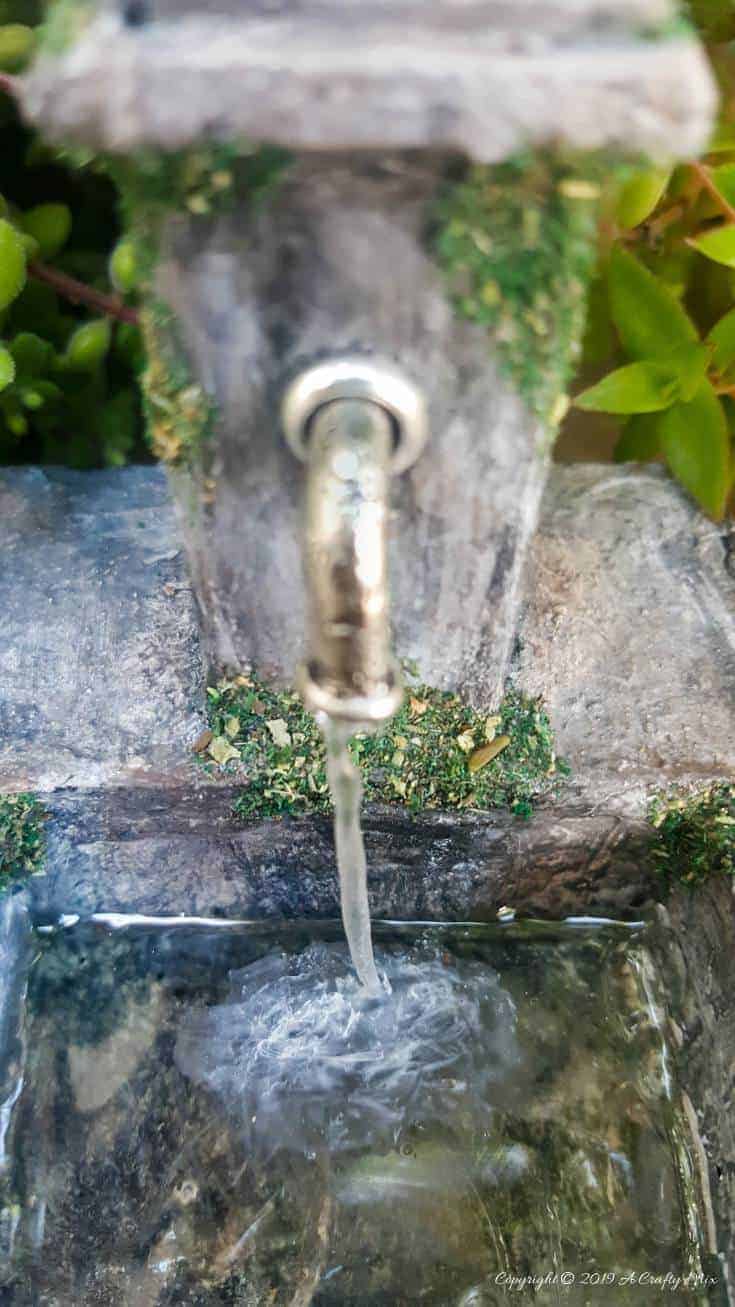 A Close up view of the moss and lichen. How to make a beautiful fairy water feature with "running" water #Miniaturewaterfeature #DIYFairyWaterFeature #WaterFeature #FairyGardens #ACraftyMix