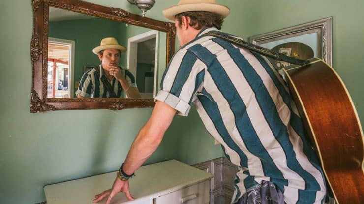 Male Musician looking in the mirror